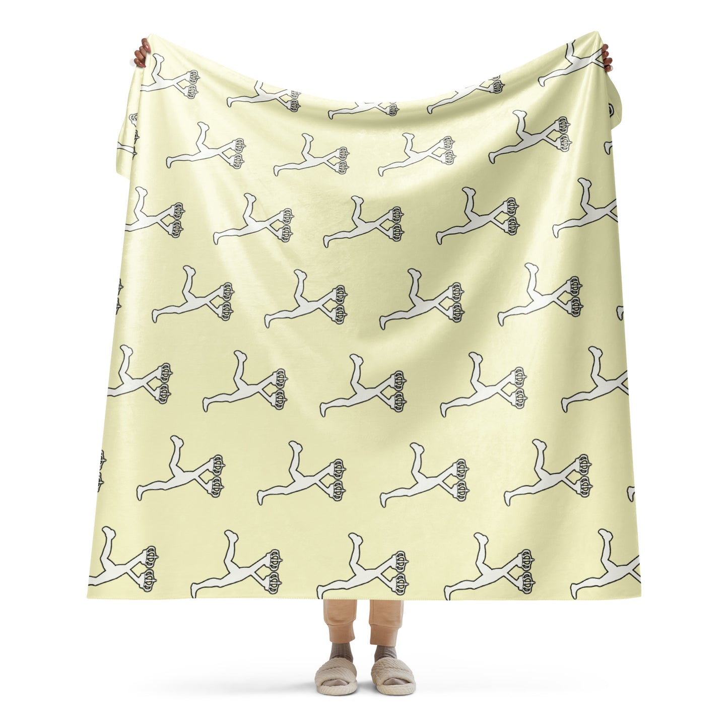 Person holding a cream blanket with black and white patterns of the most wanted Lux Runner character on a white background