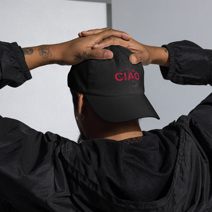 Person wearing a black cap with CIAO red text