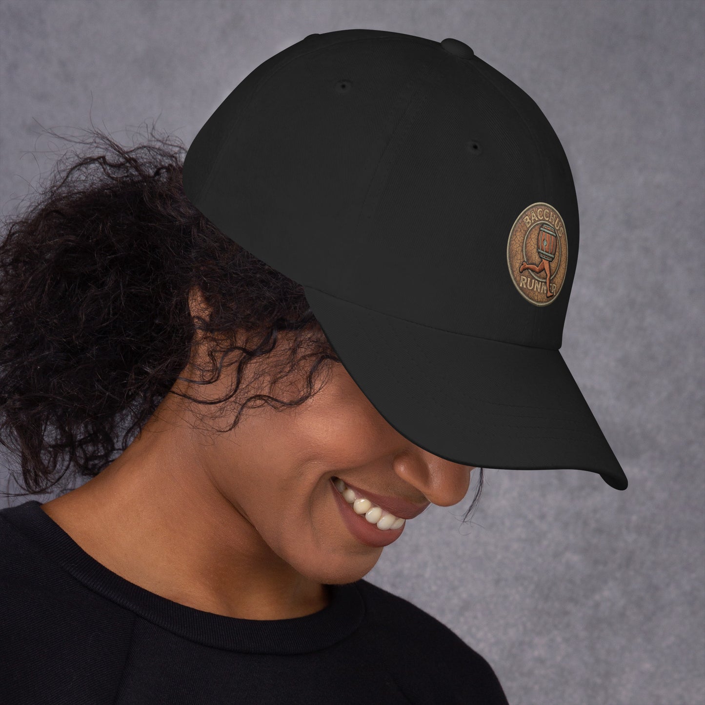 Person wearing a black hat with an original design in brown color