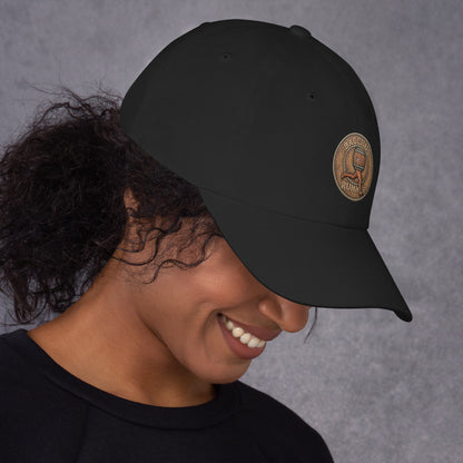 Person wearing a black hat with an original design in brown color
