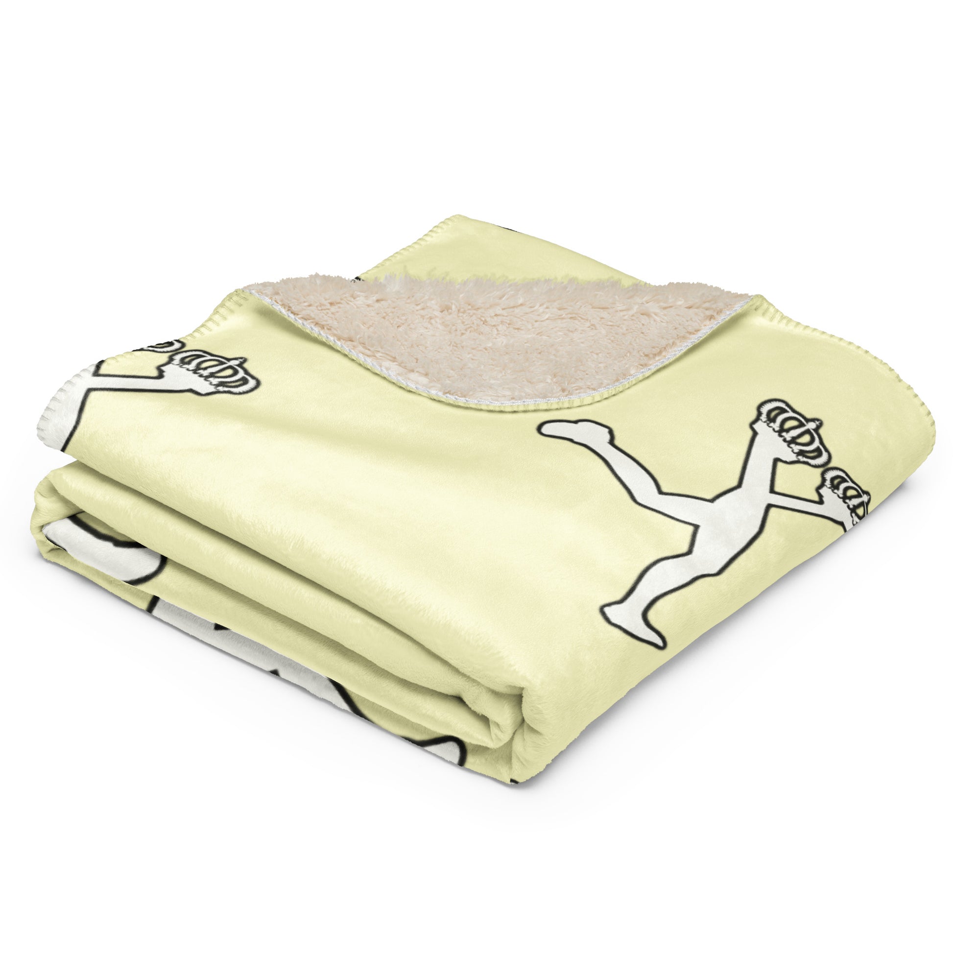 Folded cream blanket with black and white graphics of the character of Lux on a white background