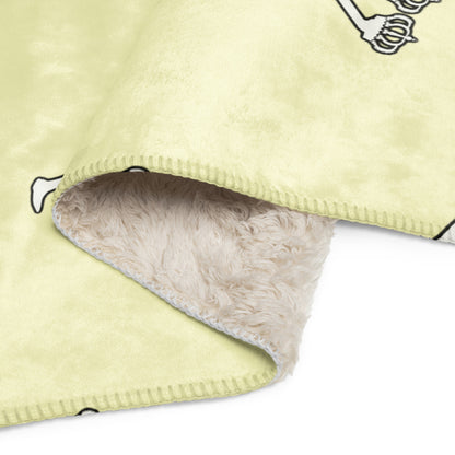 Close-up of a light  fleece blanket with a fluffy interior on a white background