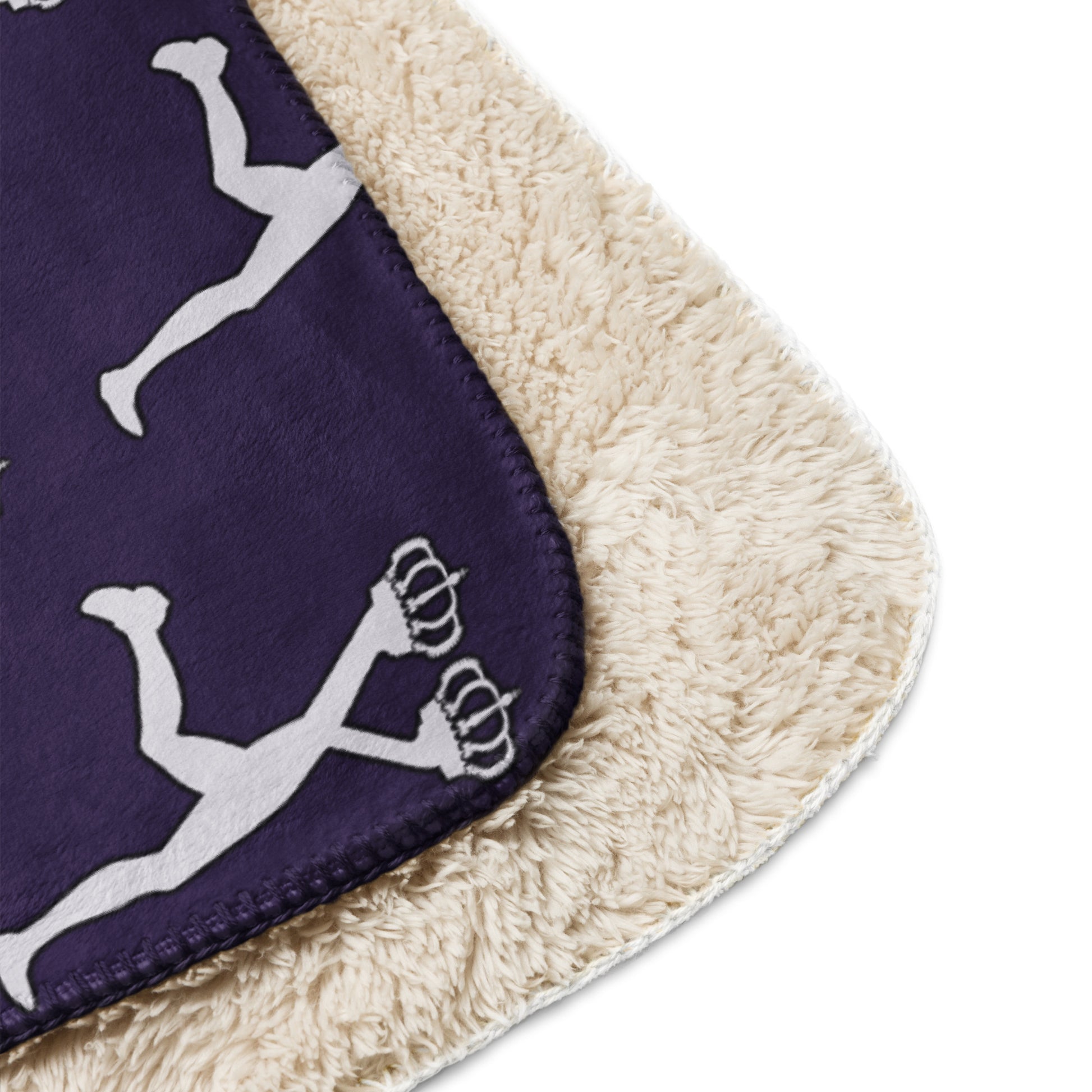 Beige and purple sherpa blanket with the white  Lux character designs on a purple background