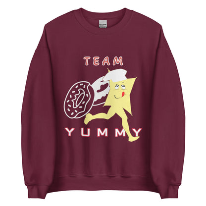Marron sweatshirt with cartoon character and text 'Team Yummy' on a white background