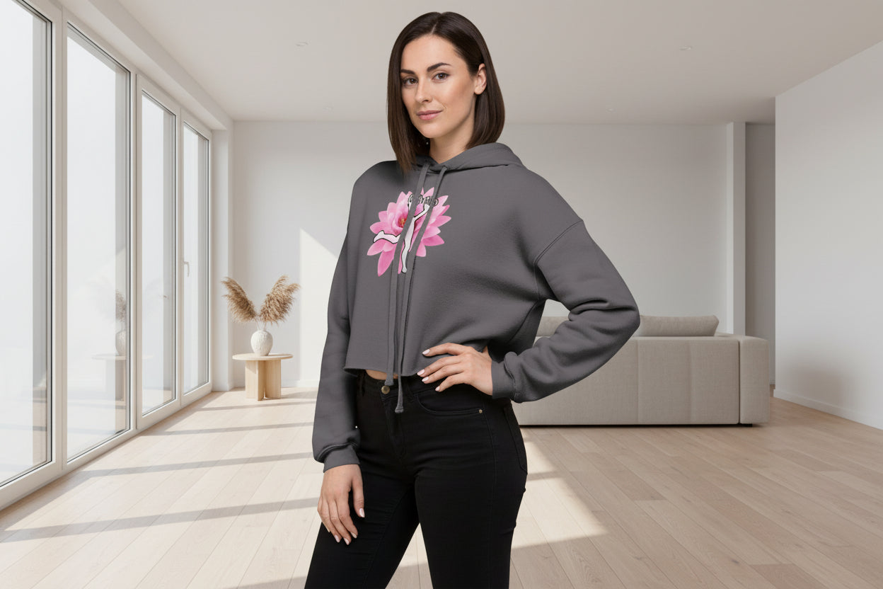 Woman wearing a gray hoodie with a pink flower design on a white background